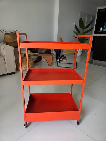 Red metal utility trolley on wheels - good condition