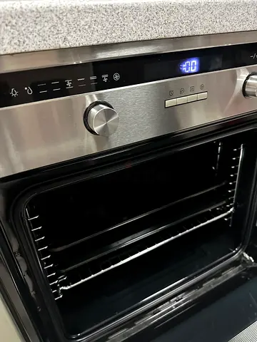 Built-in stainless steel electric oven in good condition