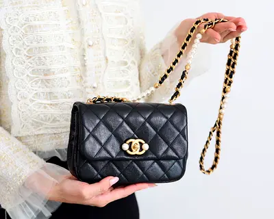 chanel flap bag in black microchipped orand new