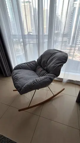 Grey padded rocking chair with cushion - modern accent chair