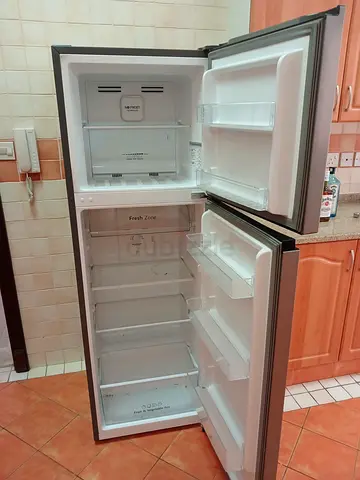 Medium-sized double-door refrigerator in good working condition