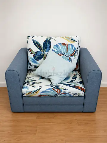 Modern Blue Armchair with Tropical Print Cushions