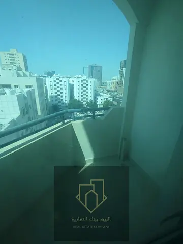 For annual rent | One-bedroom apartment with a hallway, next to Al-Hikma School | Separate living room | Balcony with an open view