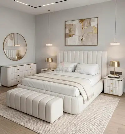 Modern upholstered king bed with matching bench and bedside tables