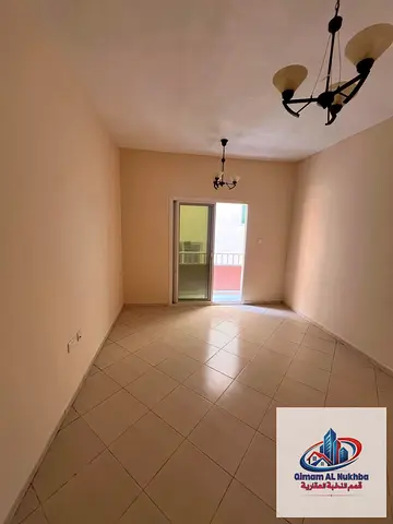 Stunning 1BR with open view balcony! Huge space, central AC/gas, flexible pay. Prime spot with quick exit to Dubai and Ajman.