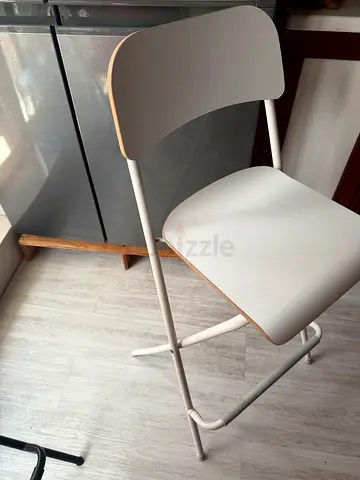 White minimalist bar stool with backrest, used