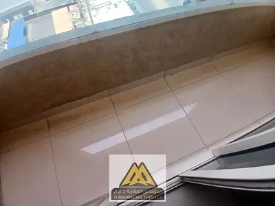 A spacious one-bedroom apartment with a balcony in Al Nuaimiya 1, near Al Hikma School, opposite Black Ramada, close to all services and main roads.