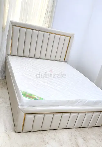 Queen upholstered bed frame with mattress - cream faux leather