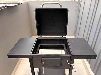 Used metal charcoal BBQ grill/smoker with side shelves - good condition