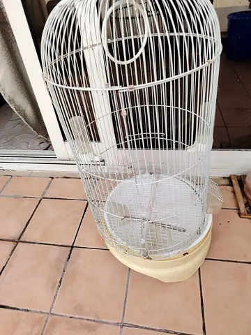 White metal bird cage with plastic base - good condition