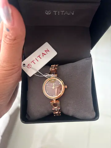 A new Titan womens rose gold bracelet watch witth original box and packaging perfect for gifting