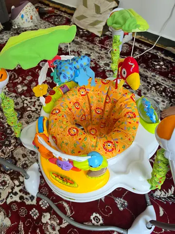 Baby jumper/exersaucer with toys - good condition