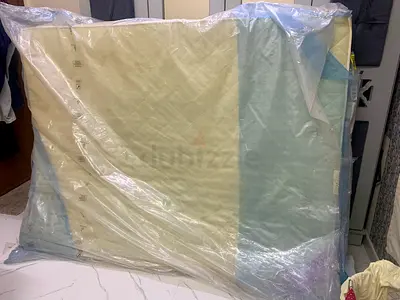 Queen size Mattress in Protective Plastic - Good Condition