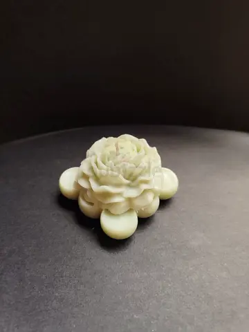 Decorative flower-shaped candle