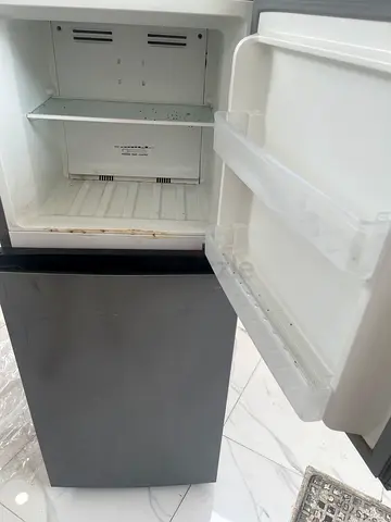 Compact single-door refrigerator with small freezer - used