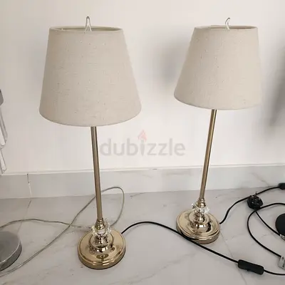 Pair of brass table lamps with beige fabric shades