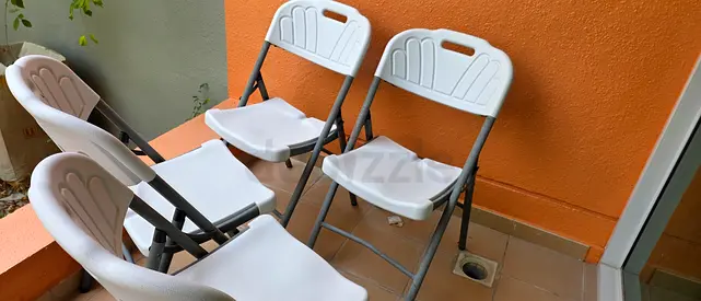 Set of 4 White Plastic Folding Chairs - Lightweight and Practical