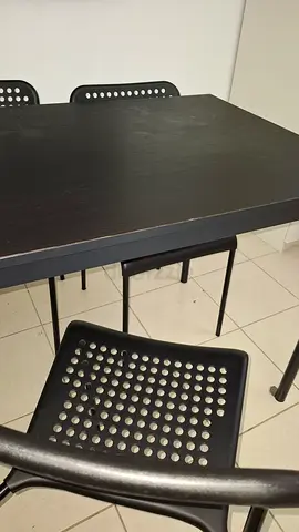 Black dining table with 3 matching perforated chairs - good condition