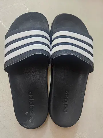 Black Adidas Adilette Slides, size 10 US gently used.