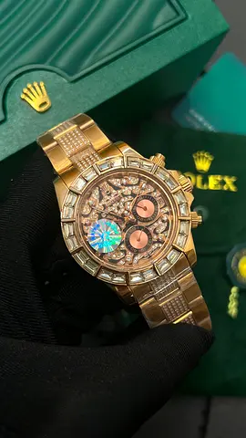 Rolex gold chronograph watch with diamond bezel and bracelet