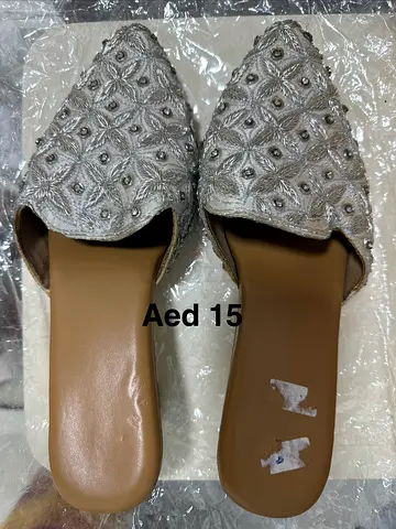 Silver embroidered slip-on flats (used) - AED 15