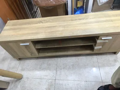 Oak finish TV entertainment unit with storage shelves and cabinets