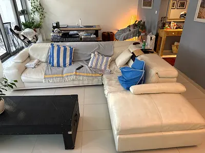 White Marina Home leather L-shaped sectional sofa with chaise