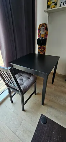 Small black wooden dining table with 2 chairs - good condition with extras