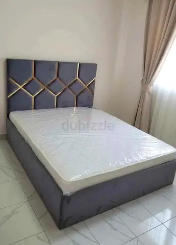 Modern Grey Upholstered Bed with Geometric Headboard and Mattress