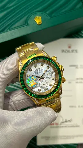 Rolex Daytona style gold watch with green gem bezel  chronograph