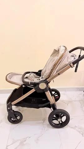 Light beige standard baby stroller in good condition