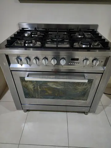 Stainless Steel Freestanding Gas Range - Good Condition. Combination Electric Oven and 5 burner.