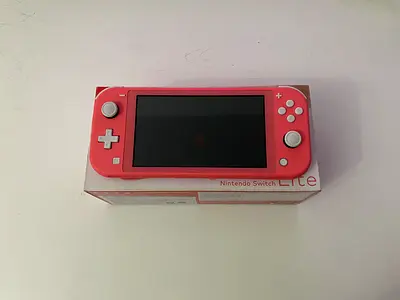 Nintendo Switch Lite [BRAND NEW] with original box, pink/coral color