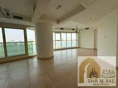 Two-bedroom apartment with a living room for annual rent in Al Majaz 3, with a sea view overlooking
