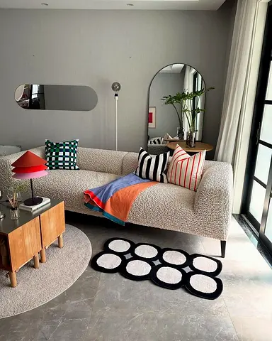 Modern boucle sofa with decorative cushions