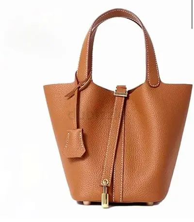 Tan Leather Bucket Handbag with Padlock Detail , plus organizer with pockets inside, not used