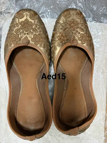 Used gold embroidered women’s flat heels / ethnic juttis - size 39 -Aed15 each pair