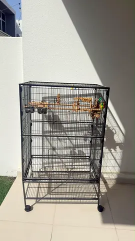 Large metal bird cage with perches and wheels - good condition