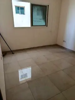 Annual apartment for rent in Al Majaz 3. One bedroom, living room, two bathrooms, central AC, free p