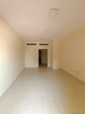 Open view with 2 balconies. Spacious 2-bedroom apartment with 2 bathrooms and central AC in Al Majaz 2, prime location near all services.