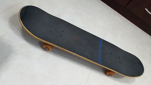 Standard Skateboard with Orange Wheels