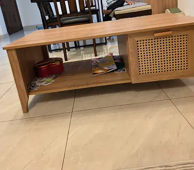 A large rattan coffee table fromhome.box... Its brand new...Bought 4months...