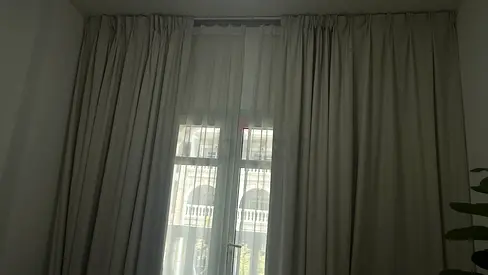 Full-length beige blackout curtains