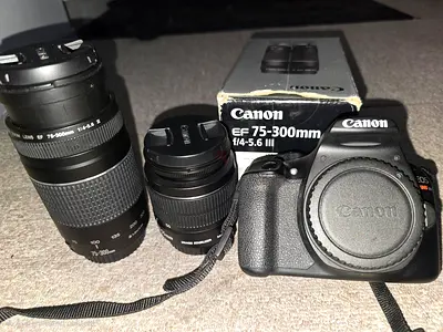 Canon EOS DSLR with 75-300mm and 18-55mm lenses (body + 2 lenses)