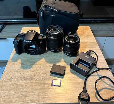 Canon EOS Rebel T100 DSLR with Two Lenses, Battery, Charger and Bag - Good Condition