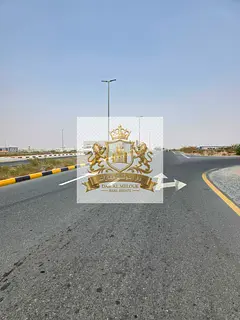 Industrial land for sale on an installment plan in a strategic location on Emirates Road, with freeh