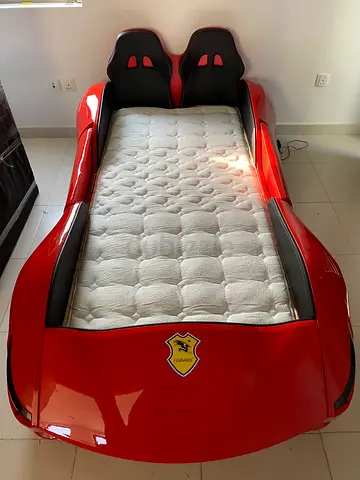 Red Race Car Kids Bed with sound and light system- Very Good Condition. Used only for 3 months. .