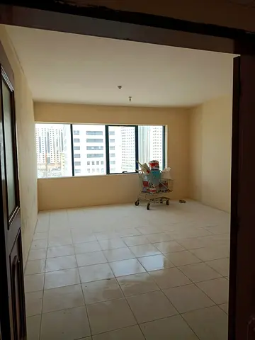 For rent in Al Majaz 1 Sharjah, spacious 1 bedroom apartment with 2 bathrooms, central AC, prime location, AED 35,000 yearly, 4 payments.