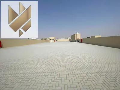 A large plot of land for rent in Al Sajaa, with a strategic location on a main street.