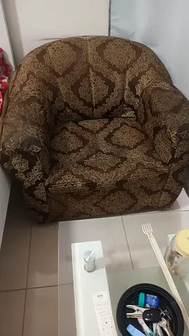 Brown patterned fabric armchair - single comfortable seat